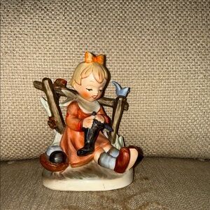 Girl knitting with a bluebird